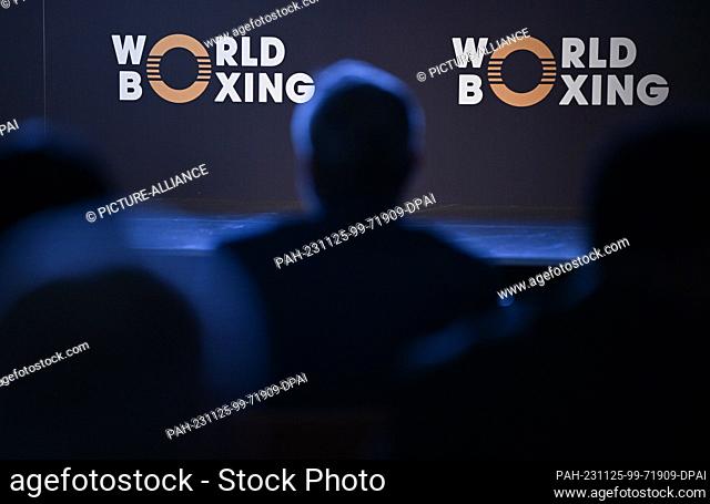25 November 2023, Hesse, Frankfurt/Main: Delegates sit in front of the association's logo at the founding congress of the new World Boxing Association
