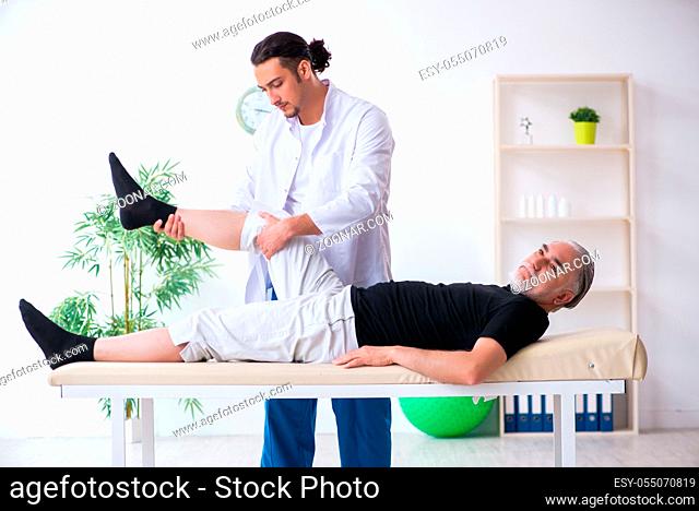 The old injured man visiting young doctor