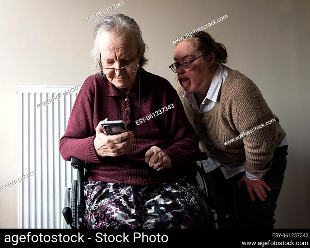 83 year old grandmother and 39 year old daughter with Down Syndrome having a family video call, Belgium