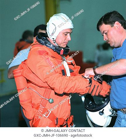 Astronaut Franklin R. Chang-Diaz, STS-91 mission specialist, equipped with parachute and other gear, is preparing for the start of an emergency bailout training...