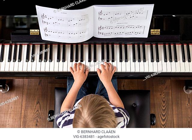 Boy, 4 years, playing piano, GERMANY, 07.05.2019. - Hamburg, , Germany, 07/05/2019