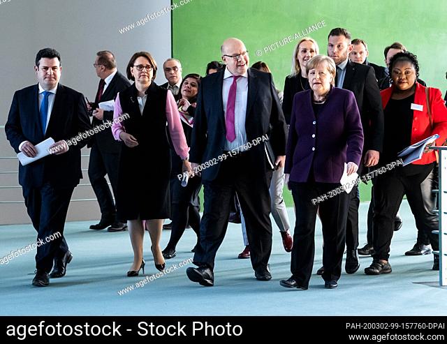 02 March 2020, Berlin: Federal Chancellor Angela Merkel (CDU, 2nd from right) will join Hubertus Heil (SPD, l-r), Federal Minister of Labour and Social Affairs