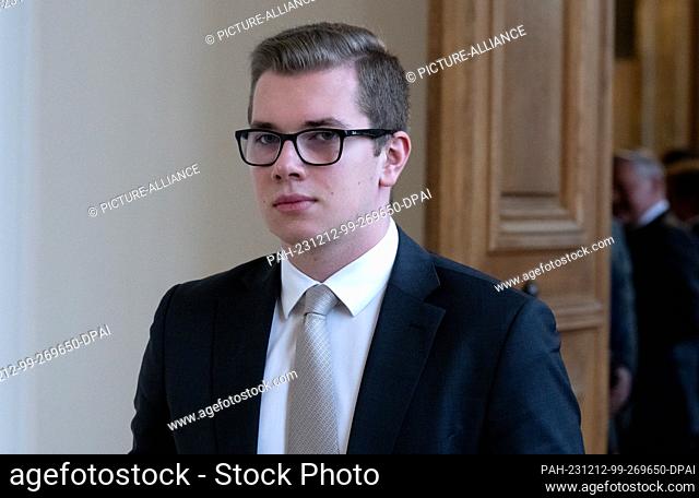 12 December 2023, Bavaria, Munich: Daniel Halemba, AfD politician, arrives at a plenary session in the Bavarian state parliament