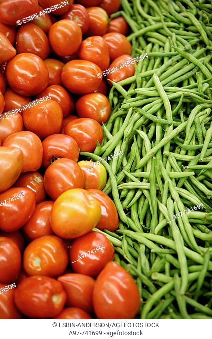 Tomatoes & green beans on display in market