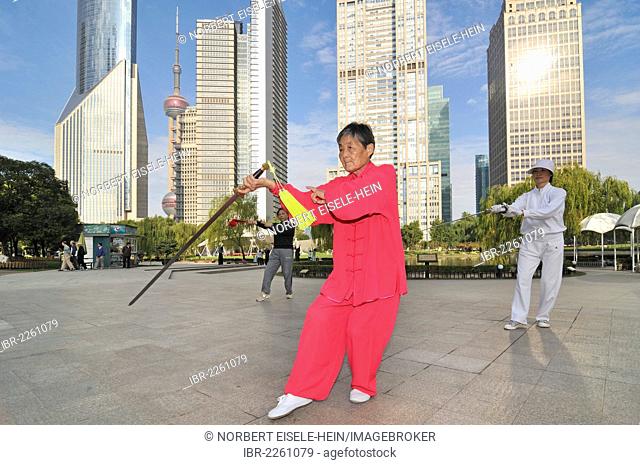 Old woman exercising, swordplay, Lujiazui Park, Oriental Pearl Tower, Pudong, Shanghai, China, Asia