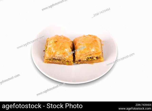 Front view of baklava serving on a plate, isolated on white background