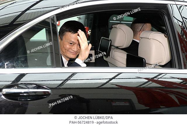 Jack Ma, founder and CEO of the Alibaba Group waves fro, his car on the opening day of the CeBIT 2015 international computer expo in Hanover, Germany