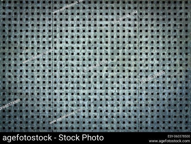 Metallic background with perforation of square holes