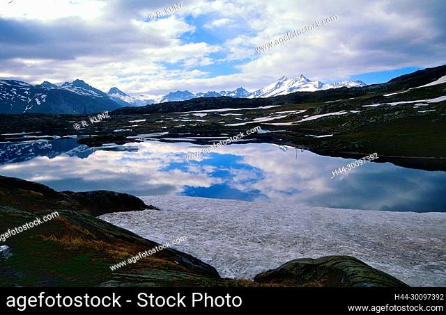 Mountain lake, Totesee, clouds, Grimsel pass, pass height, snow, Alps of Valais, Canton of Valais, Switzerland