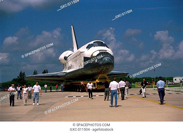 07/07/1997 --- The Space Shuttle Orbiter Discovery rolls over from Orbiter Processing Facility 2 on top of the orbiter transporter to the Vehicle Assembly...