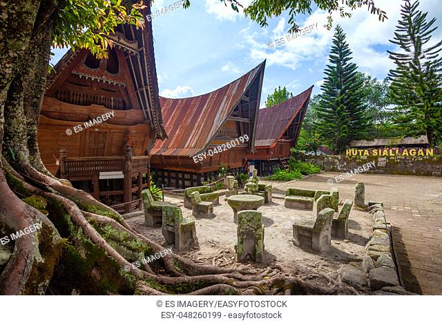Stone chairs of Ambarita and traditional Batak roof houses, Samosir Island, Lake Toba