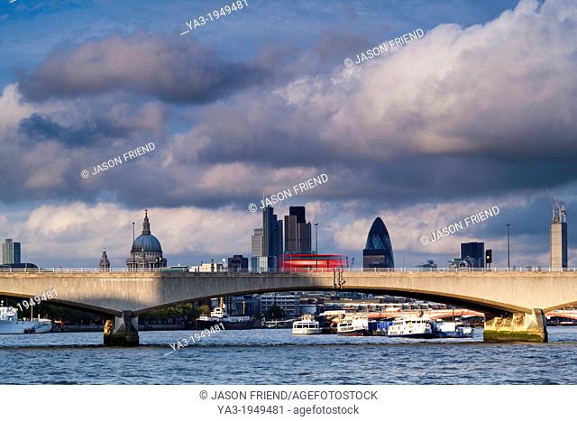 England, Greater London, London South Bank / River Thames. Waterloo Bridge, St Pauls Cathedral, the Gherkin and the financial city of london in the distance