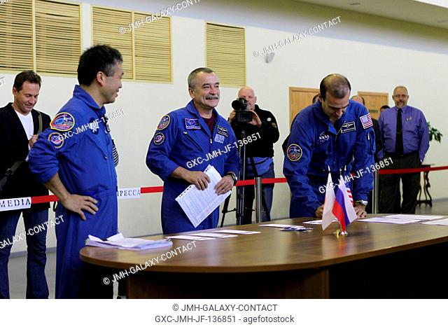 At the Gagarin Cosmonaut Training Center in Star City, Russia, Expedition 3839 Flight Engineer Rick Mastracchio of NASA (right) signs in for the start of flight...