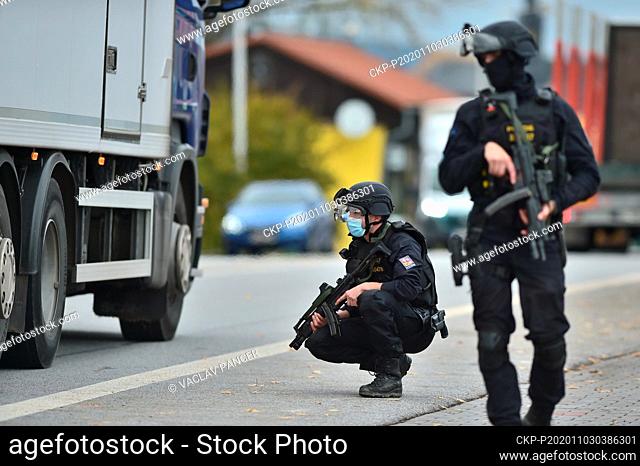 Police officers check a car at the borders between Czech Republic and Austria in Dolni Dvoriste, Czech Republic, November 3, 2020