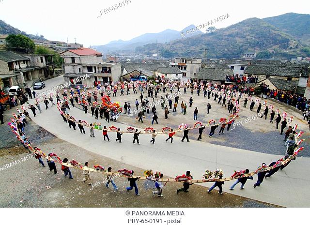 People in circle celebrating Lantern Festival, Zhejiang Province