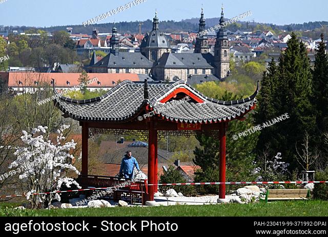 19 April 2023, Hesse, Fulda: In sight of the cathedral is a temple of the Chinese partner region Liyang on the area of the national horticultural show Fulda 2