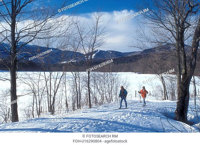 cross-country skiing, nordic ski, Stowe, winter, snow, Vermont, A couple cross-country skiing on the Recreational Path on a sunny day in winter at Stowe Ski...
