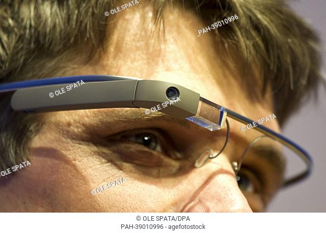 A trade fair wisitor tests the Google Glasses at the trade fair NEXT Berlin 2013 in Berlin, Germany, 24 April 2013. Next Berlin 2013 will present digital...