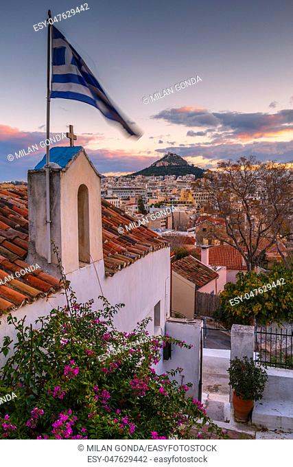 View of Lycabettus hill from Anafiotika neighborhood in the old town of Athens, Greece.