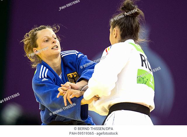 Germanys Mareen Kraeh (blue) competes with Larisa Florian of Romania in the Women's -52kg Judo Women's Bronze Final A at the Baku 2015 European Games in Heydar...
