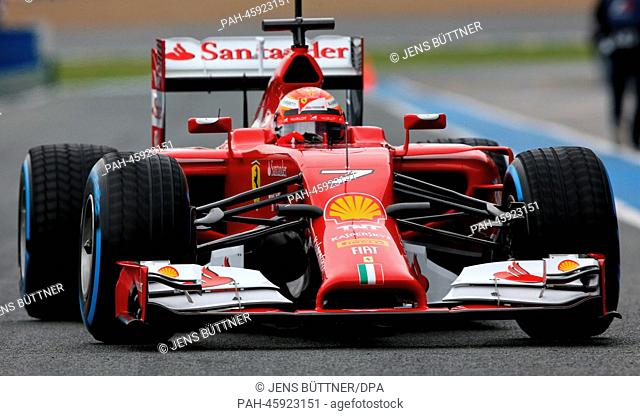 Finnish Formula One driver Kimi Raikkonen of Ferrari steers the new F14 T during the training session for the upcoming Formula One season at the Jerez racetrack...