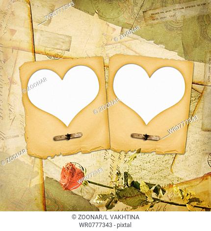 Old grunge paper frame with heart on the ancient background
