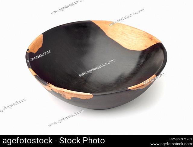 Empty ebony wood bowl isolated on white
