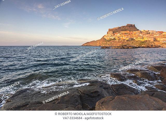 The village perched on promontory framed by sea at sunset Castelsardo Gulf of Asinara Province of Sassari Sardinia Italy Europe