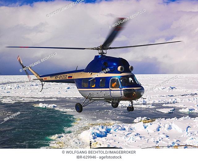 Helicopter descending to land on the Captain Khlebnikov icebreaker, Antarctic