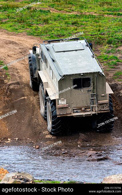 Swamp and snow extreme off-road, all-terrain vehicle Predator transportation travelers and tourists in most difficult, harsh conditions - driving on volcanic...