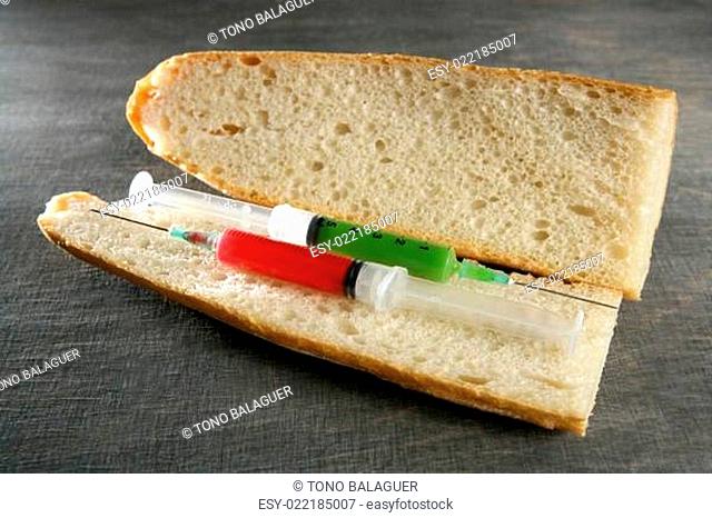two syringe in a bread sandwich