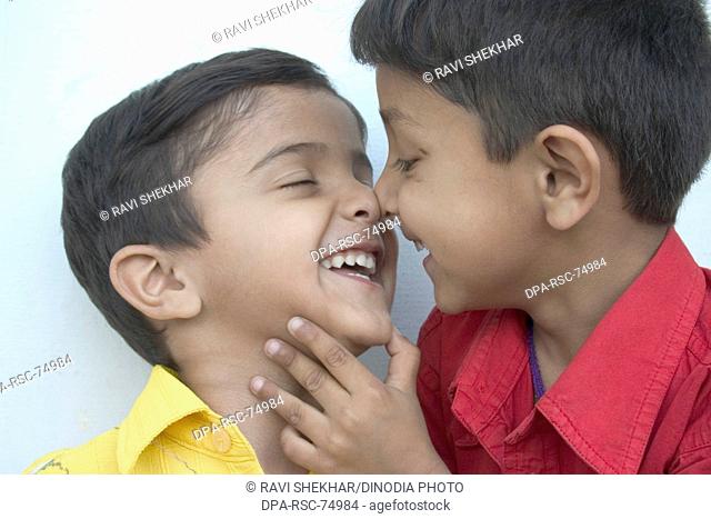 Two Indian Boys, smiling laughing playing, loving, enjoying , Dehradun , Uttranchal , India