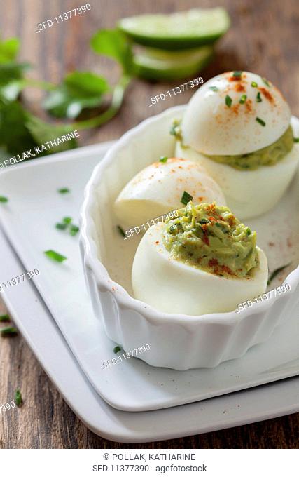 Devilled eggs with avocado cream
