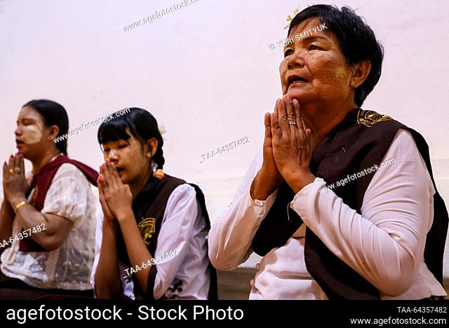 MYANMAR, BAGAN - OCTOBER 29, 2023: Locals pray in a Buddhist temple. Yuri Smityuk/TASS