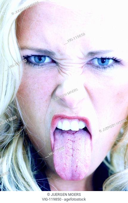 Woman sticking her tongue out. - DUESSELDORF, DEU, GERMANY, 10/08/2005