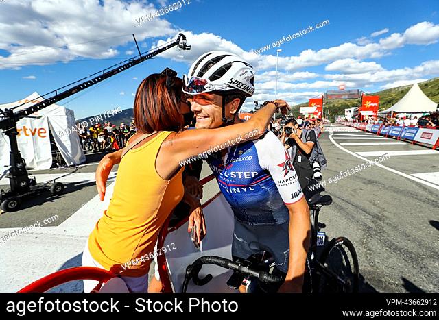 Remco Evenepoel's mother Agna Van Eeckhout celebrate with Belgian Louis Vervaeke of Quick-Step Alpha Vinyl after stage 20 of the 2022 edition of the 'Vuelta a...