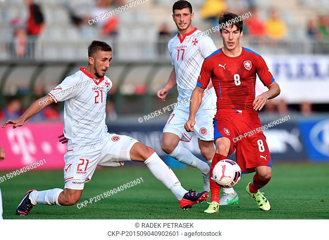 From left Liywelyn Cremona and his teammate Kyle Cesare of Malta and Robert Hruby of Czech Republic fight for a ball during qualification match for UEFA...