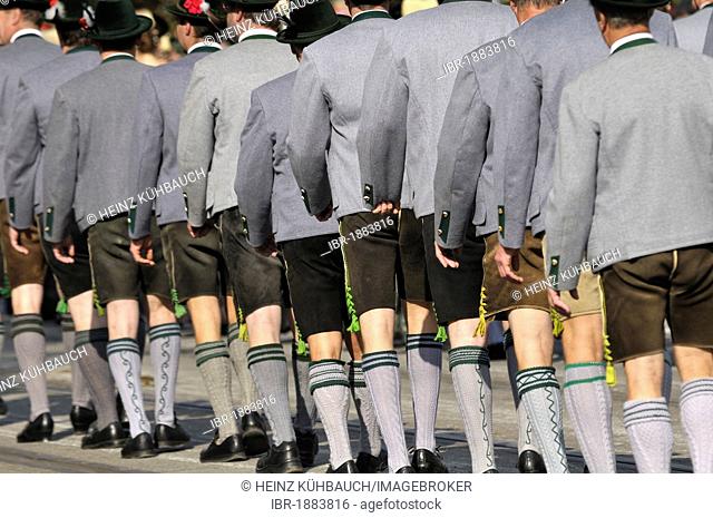 Men wearing traditional costumes with leather pants, Schuetzen- und Trachtenzug, Costume and Riflemen's Parade, for the opening of Oktoberfest 2010, Oktoberfest