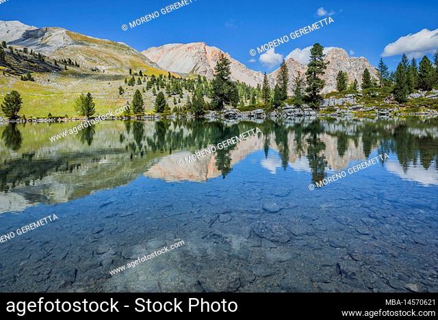 Italy, South Tyrol, Bolzano. Green Lake (Grünsee or lago Verde) in the Fanes-Sennes-Braies Nature Reserve, in the background Esengabelspitze and Antonispitze