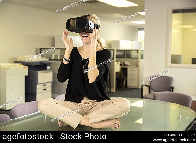 Woman looks surprised while wearing VR headset