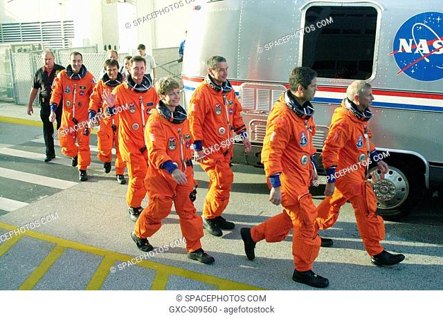 05/17/2002 -- The STS-111 crew and Expedition 5 walk eagerly to the Astrovan that will take them to Launch Pad 39A for a simulated countdown