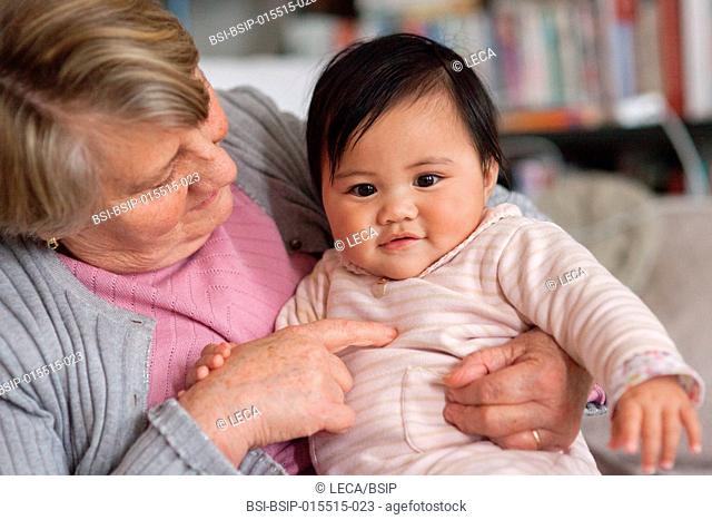7-month old baby with her adoptive grandmother