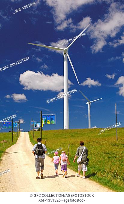 Familiy excursion to the wind farm on Mont Crosin on a summer day, Jura Mountains, Switzerland