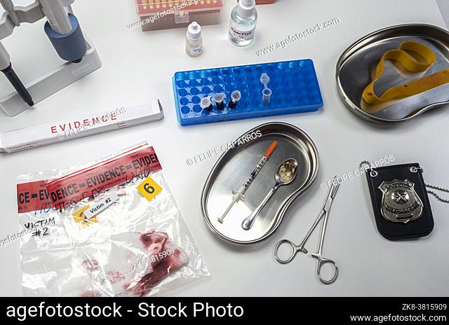 Syringe and spoon in police drug investigation department, concept image