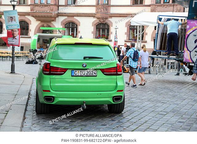 30 August 2019, Saxony, Leipzig: A BMW X5 of the election campaign team of the Prime Minister of Saxony (CDU) with the registration number C-DU 2024 parks at...