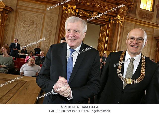 01 March 2019, Bavaria, Augsburg: Horst Seehofer, Federal Minister of the Interior (l, CSU) enters the Golden Hall of the City Hall with Kurt Gribl (CSU)