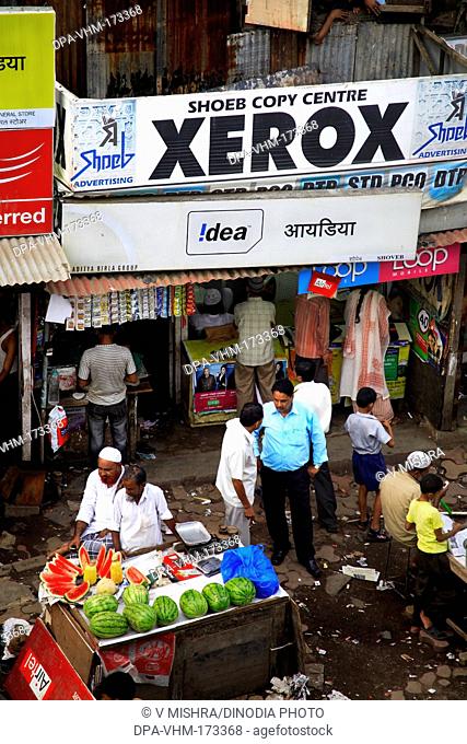 Xerox shop and watermelon vender ; Behram Naupada ; Anant Kanekar Marg ; Bandra ; Bombay Mumbai ; Maharashtra ; India 9-September-2009