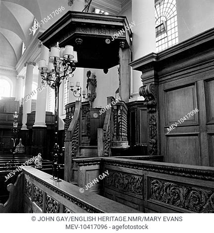 The pulpit and choir stalls in the church of St James Garlickhithe