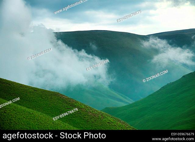 Lush and smooth Alpine meadows (alp grassland) on plateau (three thousand meters a. s. l.) as ideal place for grazing herds of cattle and easy walks for hikers