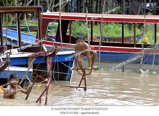 Children bathing in the lake , floating village of Kompong Phluk, Siem reap Province, Kingdon of Cambodia. Kompong Phluk